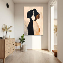 Load image into Gallery viewer, Modern interior with a painting of two silhouetted figures on a wall.
