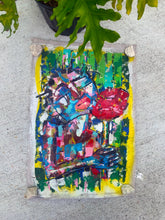 Load image into Gallery viewer, A vibrant, abstract acrylic painting on raw canvas featuring a figure with a flower.
